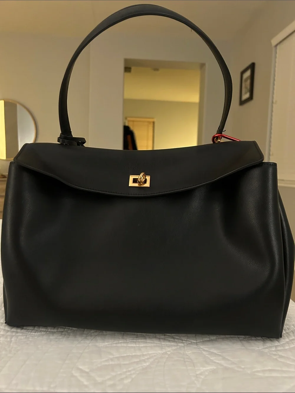 Black Leather Top-Handle Bag with Gold Hardware, keychain and lucky charm